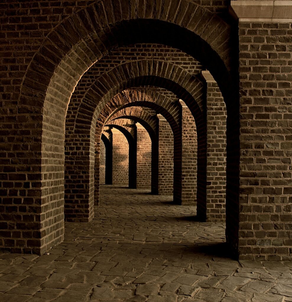 Explore the timeless beauty of an ancient brick archway corridor with striking architectural design.